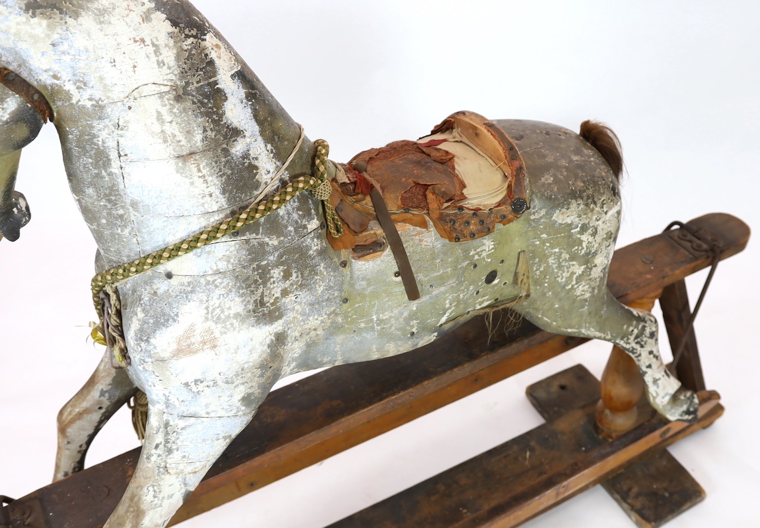 A Victorian carved and painted wood rocking horse, 174cm long 145cm high